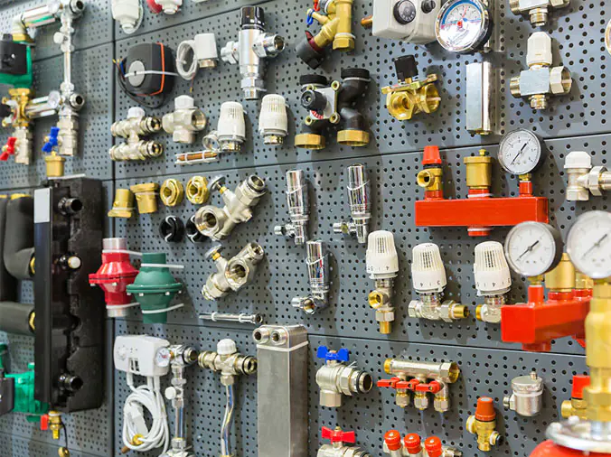 Various brass plumbing fitrtins in a plumbing supply house