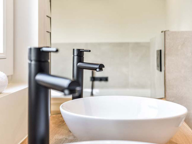 Dual basin sinks with black faucets